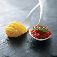 pasta and sauce on plastic utensils