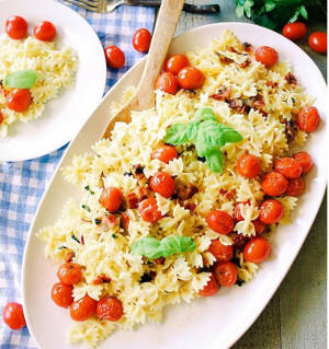 Farfalle pasta salad with cherry tomatoes and basil
