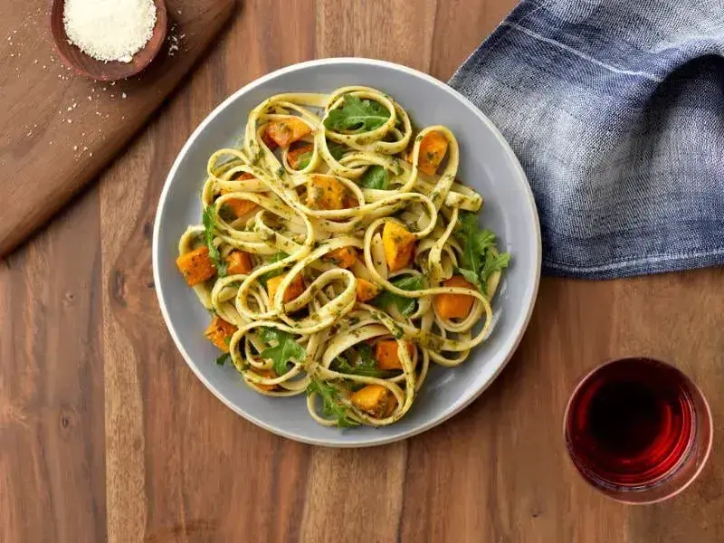 Barilla® Fettuccine with Pesto, Arugula, Butternut Squash and Asiago Cheese Recipe | US_PROD-07c835db-f502-4acf-ba76-9aa4a7e5b05d