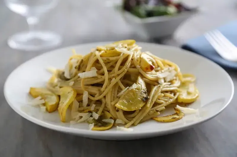 Spaghetti with Yellow Squash, Barilla® Rustic Basil Pesto and Parmigiano Cheese Recipe | US_PROD-f01cf4da-38c1-48cb-ada0-7ee47f1cf72e