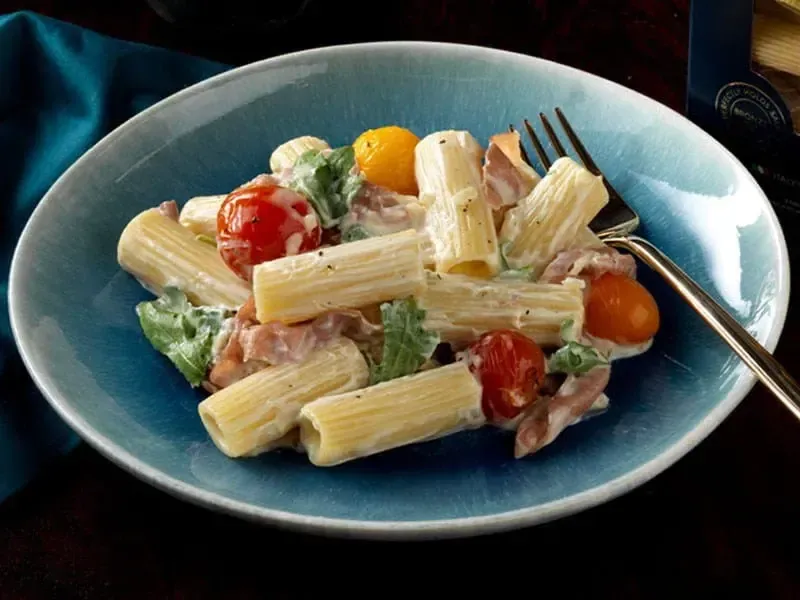 Barilla® Rigatoni Pasta with Creamy Prosciutto Di Parma, Arugula and Cherry Tomato Sauce Recipe | US_PROD-d09f81ef-4f53-4ec7-8789-3c46f4569361