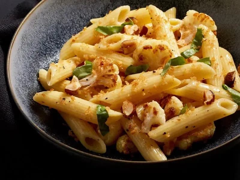 Barilla® Penne Pasta with Sautéed Cauliflower, Caramelized Onion, Hazelnuts and Bread Crumb Topping Recipe | US_PROD-ba5423bc-6aa3-46f7-bde0-f260a2e41e37