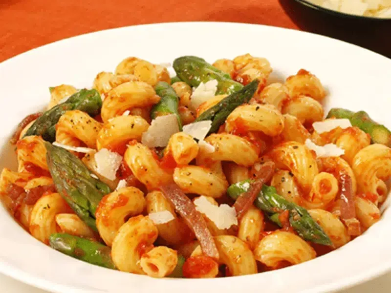 Barilla® Cellentani Pasta with Prosciutto, Asparagus, Tomatoes and Asiago Cheese Recipe | US_PROD-91c7e6ec-e958-49ca-8b2a-bbec66e500d3
