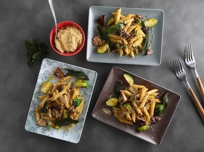 Barilla® Protein+® Penne Pasta with Mushrooms, Brussels Sprouts, Parsley, Crispy Sage and Toasted Almond Recipe | US_PROD-81a4dfbe-a141-4895-962b-be2ece6000bb