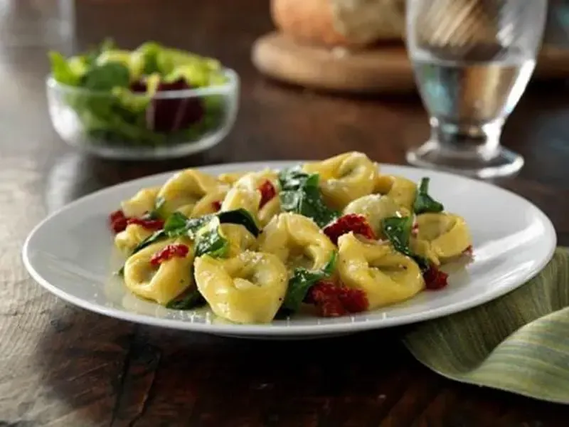 Barilla® Cheese and Spinach Tortellini with Sun-Dried Tomatoes, Fresh Spinach and Parmigiano Recipe | US_PROD-292b7b66-f9b1-4358-9232-e14529d925d6