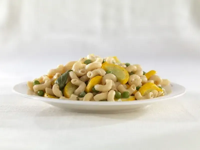 Barilla® Protein+® Elbow Macaroni Pasta with Peas, Yellow Squash, Parmigiano Cheese and Sage Butter Sauce Recipe | US_PROD-b8592f62-a6a9-40f9-836d-190a27f5db93