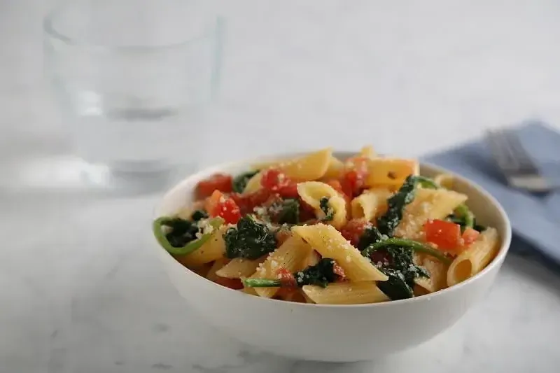 Barilla® Gluten Free Penne Pasta with Spinach, Tomatoes and Parmigiano Cheese Recipe