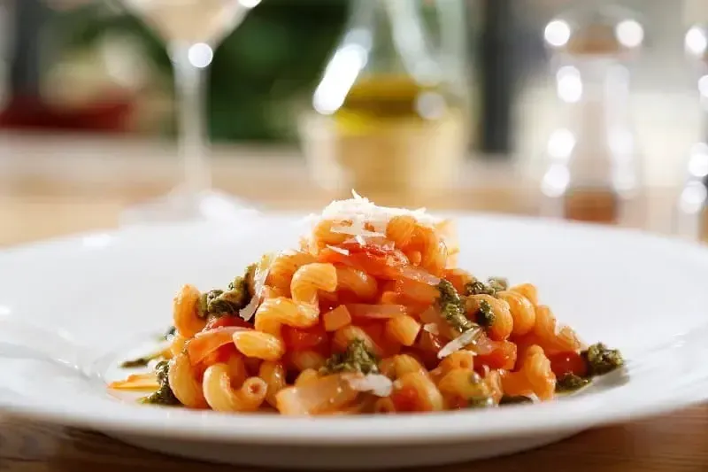 Barilla® Cellentani Recipe with San Marzano Tomatoes, Vidalia Onions, and Pesto Grana Pandano Cheese Recipe | US_PROD-de681503-10c1-4387-b433-21cbe983b05c