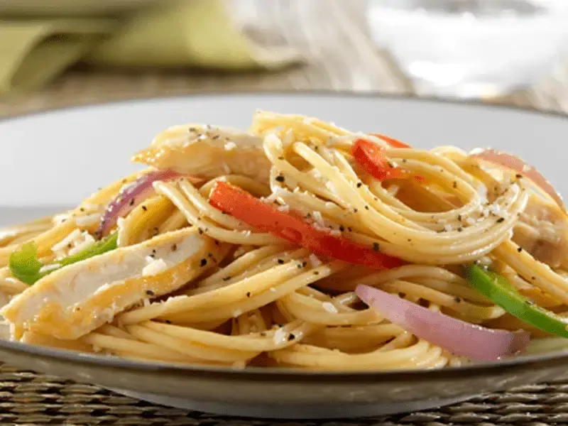 Barilla® Protein+® Spaghetti with Chicken Breast, Bell Peppers, Red Onion and Romano Cheese Recipe | US_PROD-99b7d5bb-c937-44a7-af84-be4344e29f52