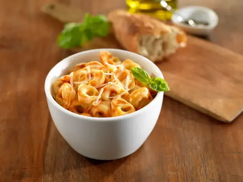 Barilla® Three Cheese Tortellini with Parmigiano Cheese and Traditional Tomato Sauce Recipe | US_PROD-4ecffe42-ddbd-4a81-85e8-af3a3a49cba1