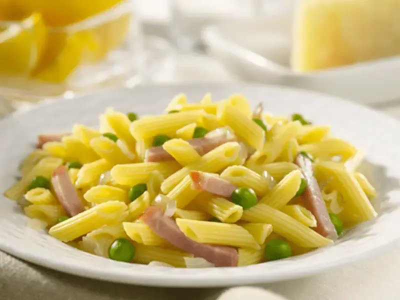 Barilla® Mini Penne Pasta with Ham, Peas and Creamy Parmigiano Cheese Sauce Recipe | US_PROD-88ee6107-f669-4035-bc5b-60d76282a38b