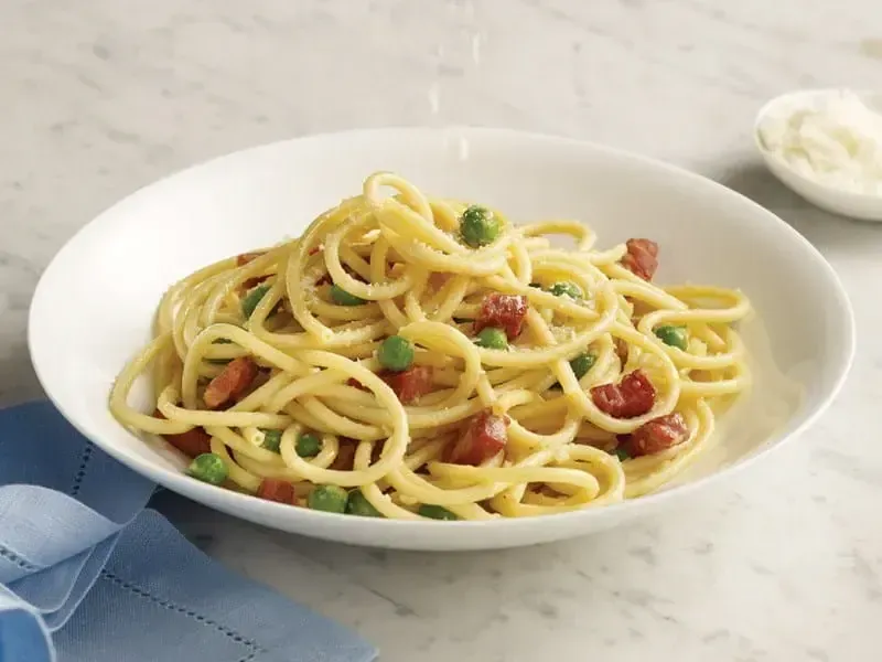 Barilla® Bucatini Pasta con Pancetta E Piselli Recipe | US_PROD-1efb1c32-e6de-42f2-9015-7f8e70ac12fb