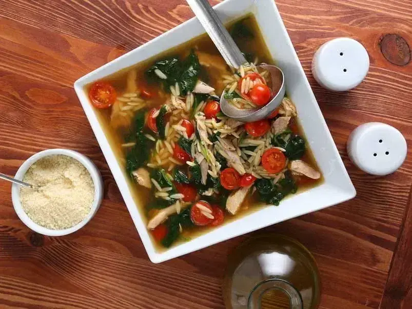 Barilla® Italian Chicken Orzo Soup with Cherry Tomatoes and Parmigiano-Reggiano Cheese Recipe | US_PROD-301498c4-e041-40b6-baf1-a32e9a7b2127
