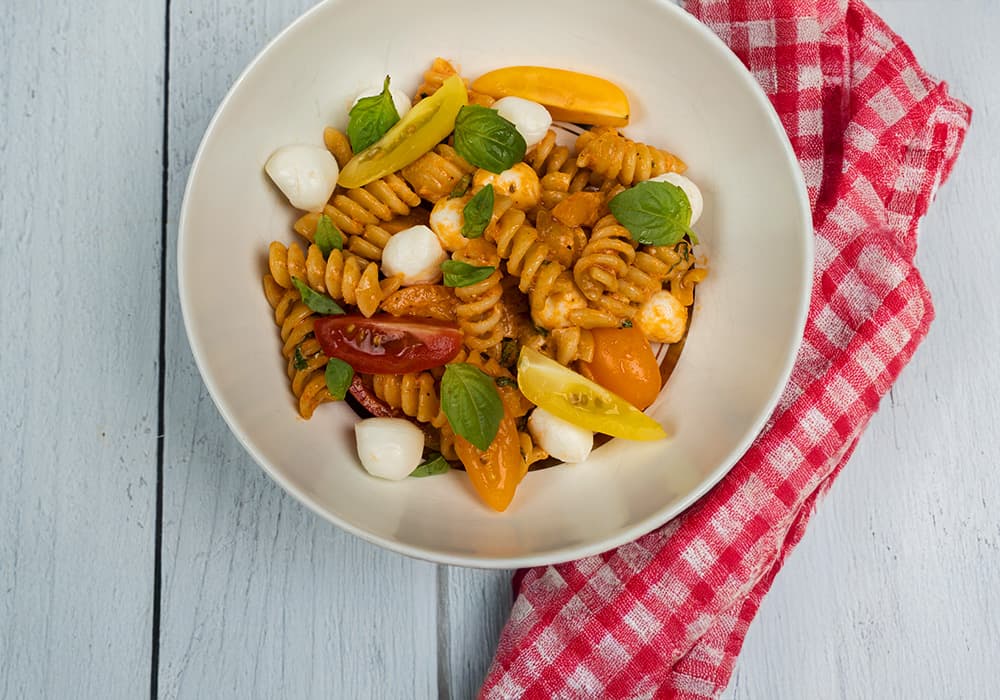 Barilla® Rotini Pasta Creamy Tomato Pesto Caprese Salad Recipe | US_PROD-4uGN3cBiY8JmIki1pAbWyg