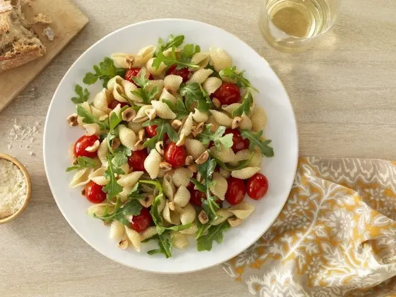 Barilla® Medium Shell Pasta with Baby Arugula, Cherry Tomatoes and Toasted Hazelnuts Recipe | US_PROD-827b9c93-4fa9-4907-8d90-8c5e96b20cb8