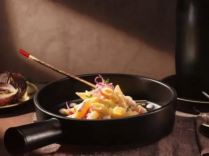 Barilla® Al Bronzo® Penne Pasta with Caramelized Onions, Parmigiano Cheese and Fresh Thyme Recipe | US_PROD-19963714-2540-48b7-9534-71293785976f