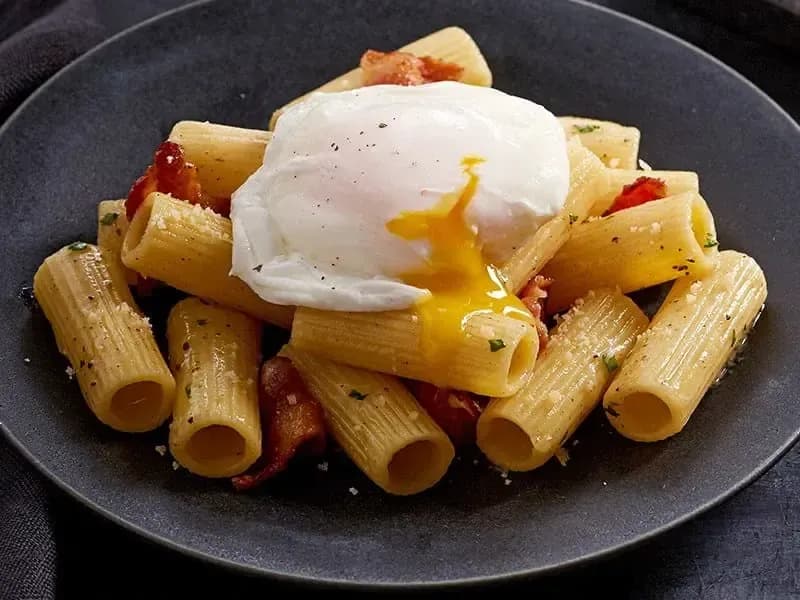 Barilla® Rigatoni Pasta with Hickory Smoked Bacon, Parmigiano Cheese, Poached Egg and Truffle Butter Recipe | US_PROD-f69ea8fd-5658-4748-b27f-2c7b342b08a9