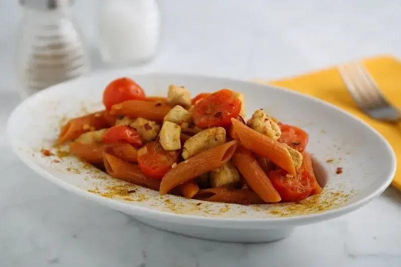 Barilla® Red Lentil Penne with Chicken, Garlic, Red Pepper Flakes, Madras Curry, and Cherry Tomatoes Recipe | US_PROD-b4f63127-4d11-48ec-bf08-4103dec5bee8