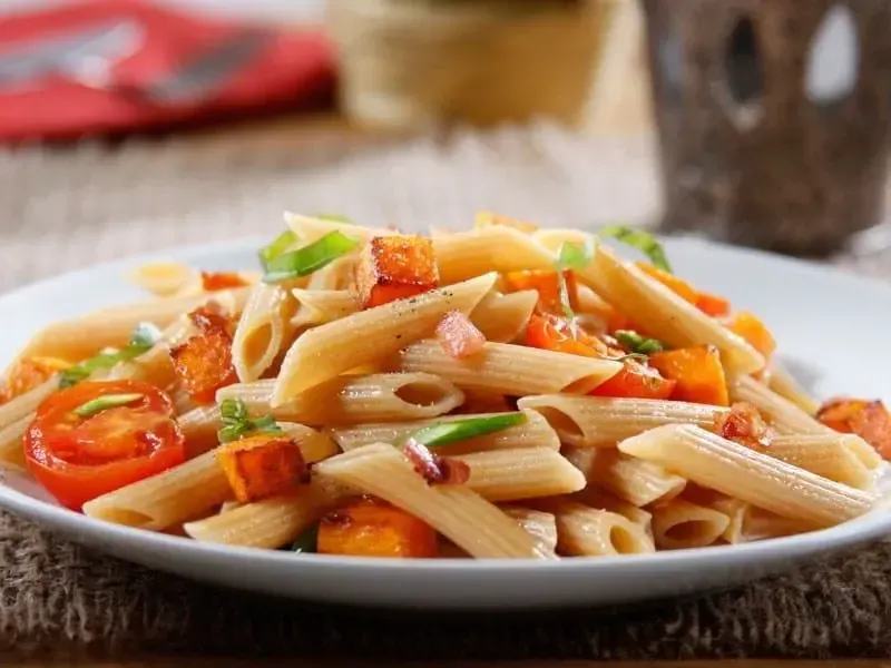 Barilla® Whole Grain Penne Pasta with Asparagus, Butternut Squash, Cherry Tomatoes and Prosciutto Recipe | US_PROD-6761313d-9375-40be-a0d3-b53e86e879f7