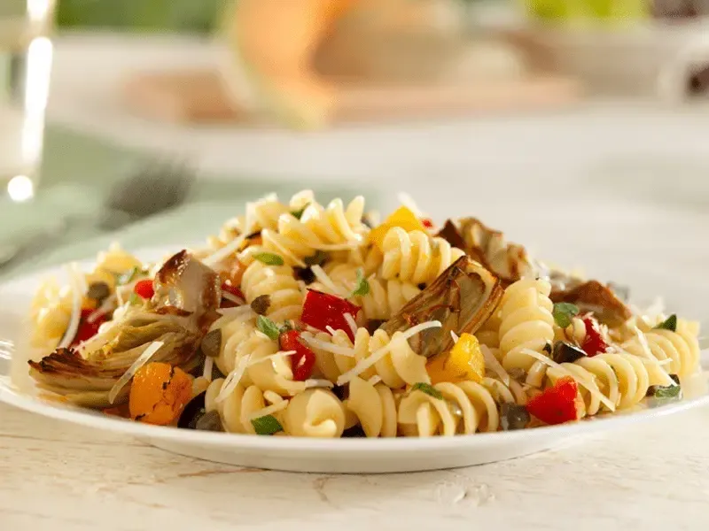 Barilla® Rotini Pasta Salad with Artichokes, Black Olives, Capers, Roasted Peppers and Parmigiano Recipe | US_PROD-9dda83c2-9b32-4536-b78c-a1223ad21d02