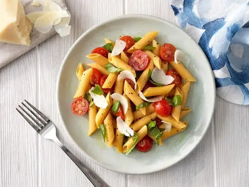Barilla® Chickpea Penne Pasta with Tomatoes, Fresh Basil and Parmigiano-Reggiano Recipe | US_PROD-95ae1871-44aa-410c-9ed4-1b13713fa7f3