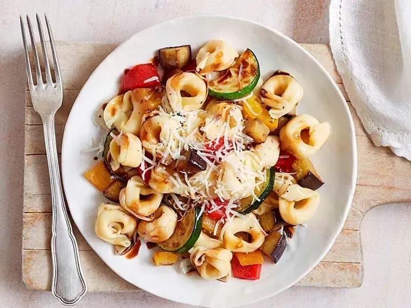 Barilla® Three Cheese Tortellini Pasta Salad with Roasted Veggies, Parmigiano Cheese and Balsamic Drizzle Recipe | US_PROD-3d7562a4-5fed-4b04-be65-97d7ae95f63b