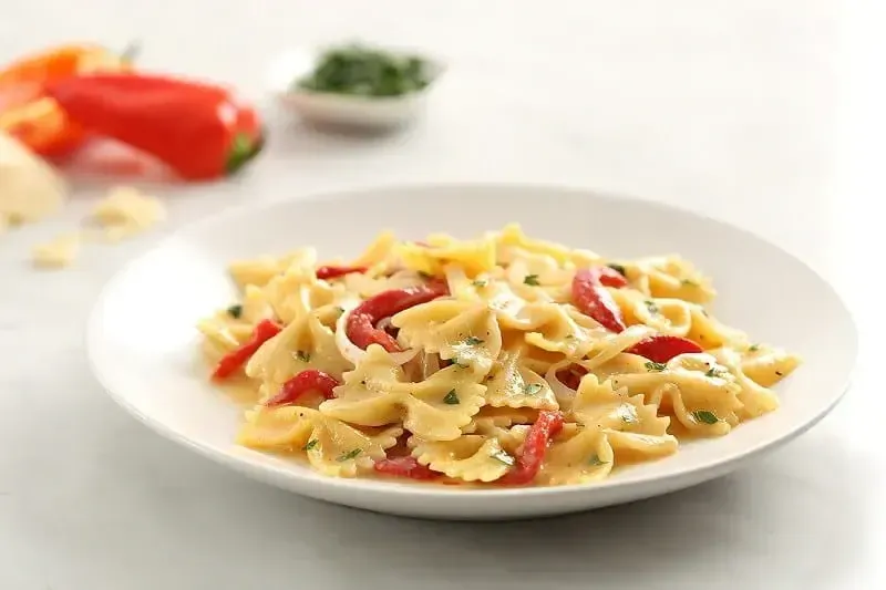 Barilla® Farfalle “Carbonara” with Roasted Red Peppers and Vidalia Onions Recipe | US_PROD-dc9369ef-565e-4bd0-9d43-5b27a9497117