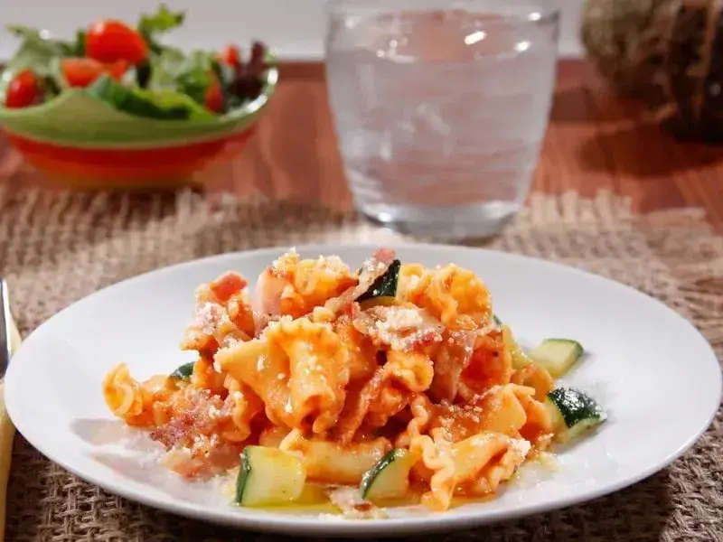 Campanelle Pasta with Creamy Barilla® Traditional Sauce, Bacon, and Zucchini Recipe | US_PROD-7bf09004-0830-4aad-9620-a9f7761f3212