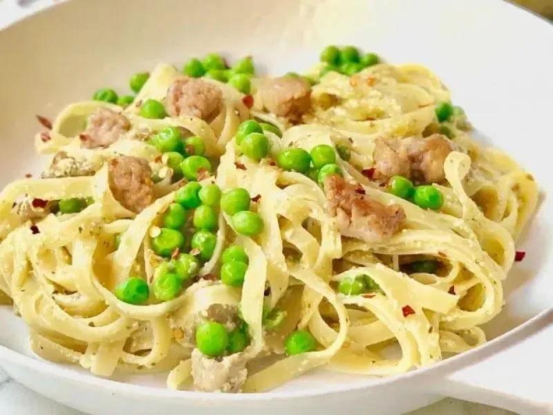 Linguine Pasta with Peas, Pork Sausage, Ricotta and Barilla® Creamy Genovese Pesto Recipe | US_PROD-7b950804-4236-4393-8eba-dd44d3d2f1a5