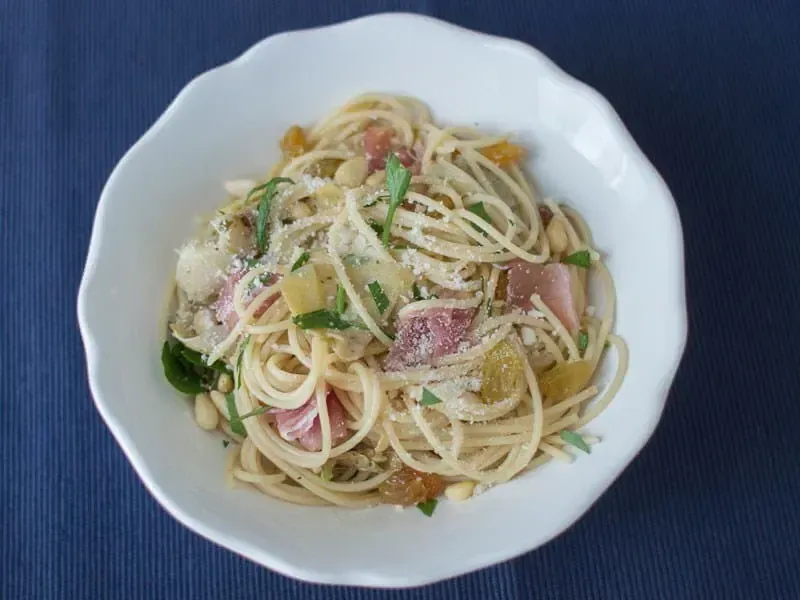 Barilla® Protein+® Thin Spaghetti Pasta with Roasted Artichokes, Pine Nuts, Golden Raisins, Pancetta and Parmigiano Cheese Recipe | US_PROD-36700f2e-8b8e-46d0-97e7-ce3fb95fa874