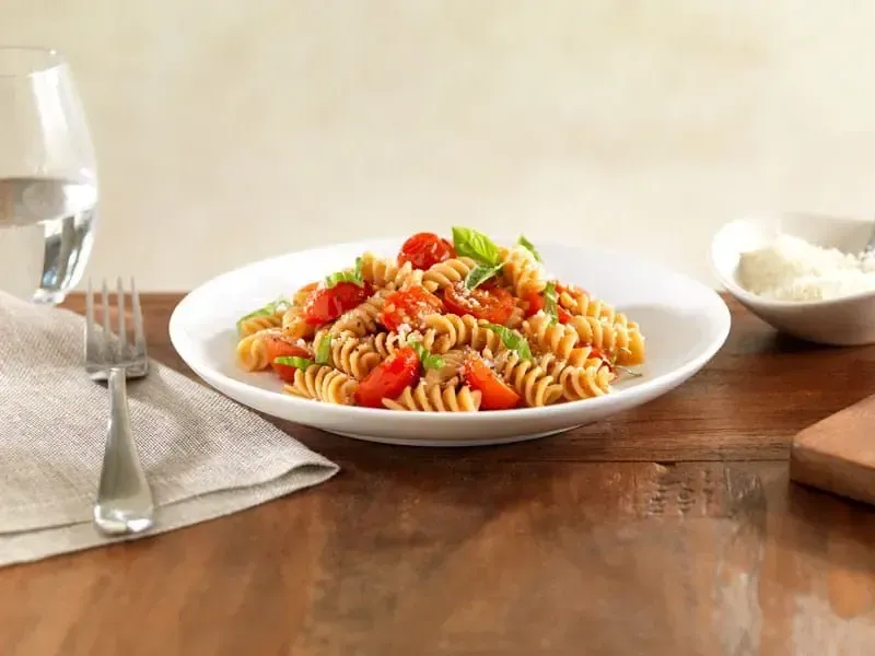 Barilla® Whole Grain Rotini Pasta with Cherry Tomatoes, Basil and Parmigiano Cheese Recipe | US_PROD-286a3a0f-3f94-4a5e-95c5-e98f8bb8bc35