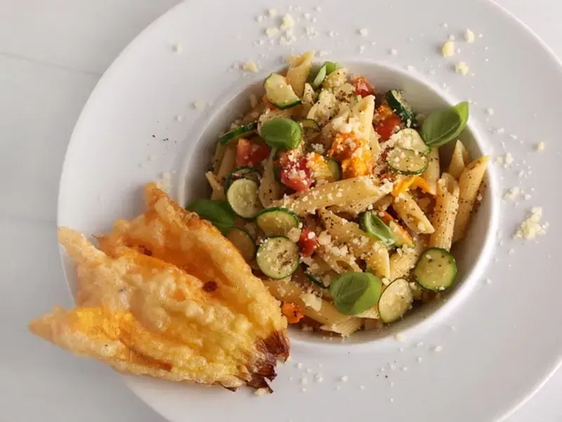 Barilla® Penne Pasta with Fried Zucchini Blossoms and Heirloom Tomatoes Recipe | US_PROD-d8bd5f94-1957-43aa-9af1-4e2a073029be