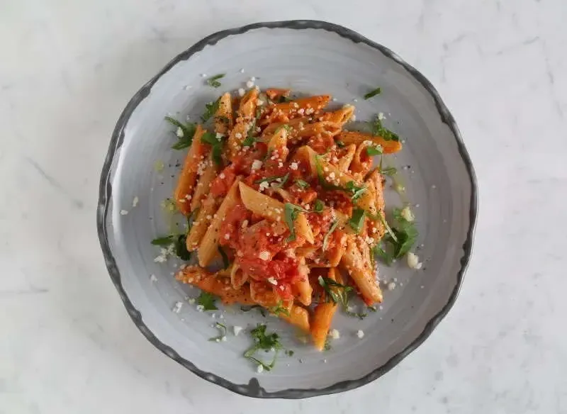 Barilla® Protein+® Penne Pasta with Creamy Tomato, Bacon and Fresh Basil Sauce Recipe | US_PROD-f140f9e1-04b5-4c78-a99a-8e127c3059f6