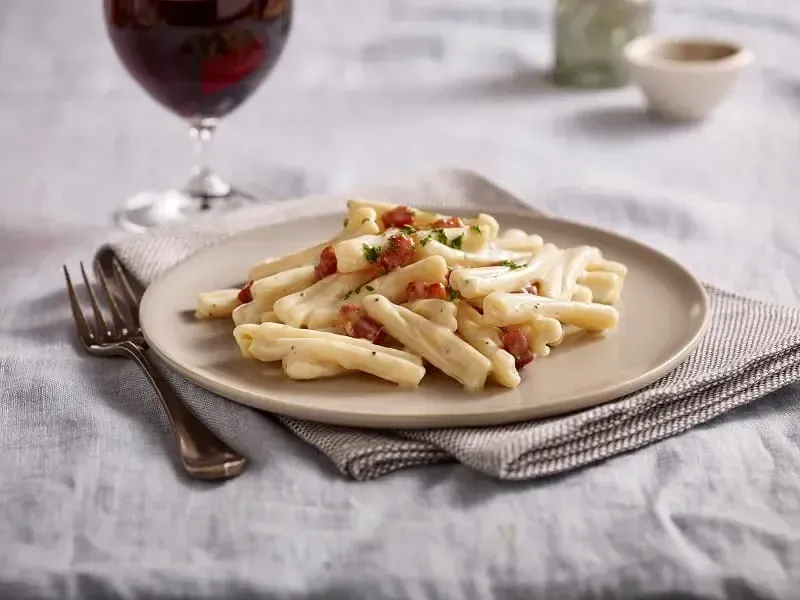 Barilla® Pancetta and Romano Casarecce in a Creamy Alfredo Sauce Recipe | US_PROD-3b3db7ff-bdd8-4a19-a1df-2102f52e00ae