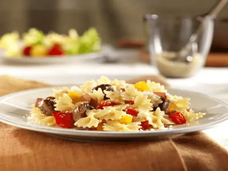 Barilla® Mini Farfalle Pasta with Sausage, Peppers and Pecorino Cheese Recipe | US_PROD-e526bb32-fd12-4918-93c3-c6ea3f57bf1d