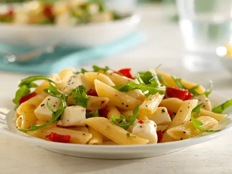 Barilla® Penne Salad with Roasted Peppers, Sun Dried Tomatoes, Arugula Fresh Mozzarella and Basil Recipe | US_PROD-6923ec99-3147-41e8-98fc-891c6be20ad3